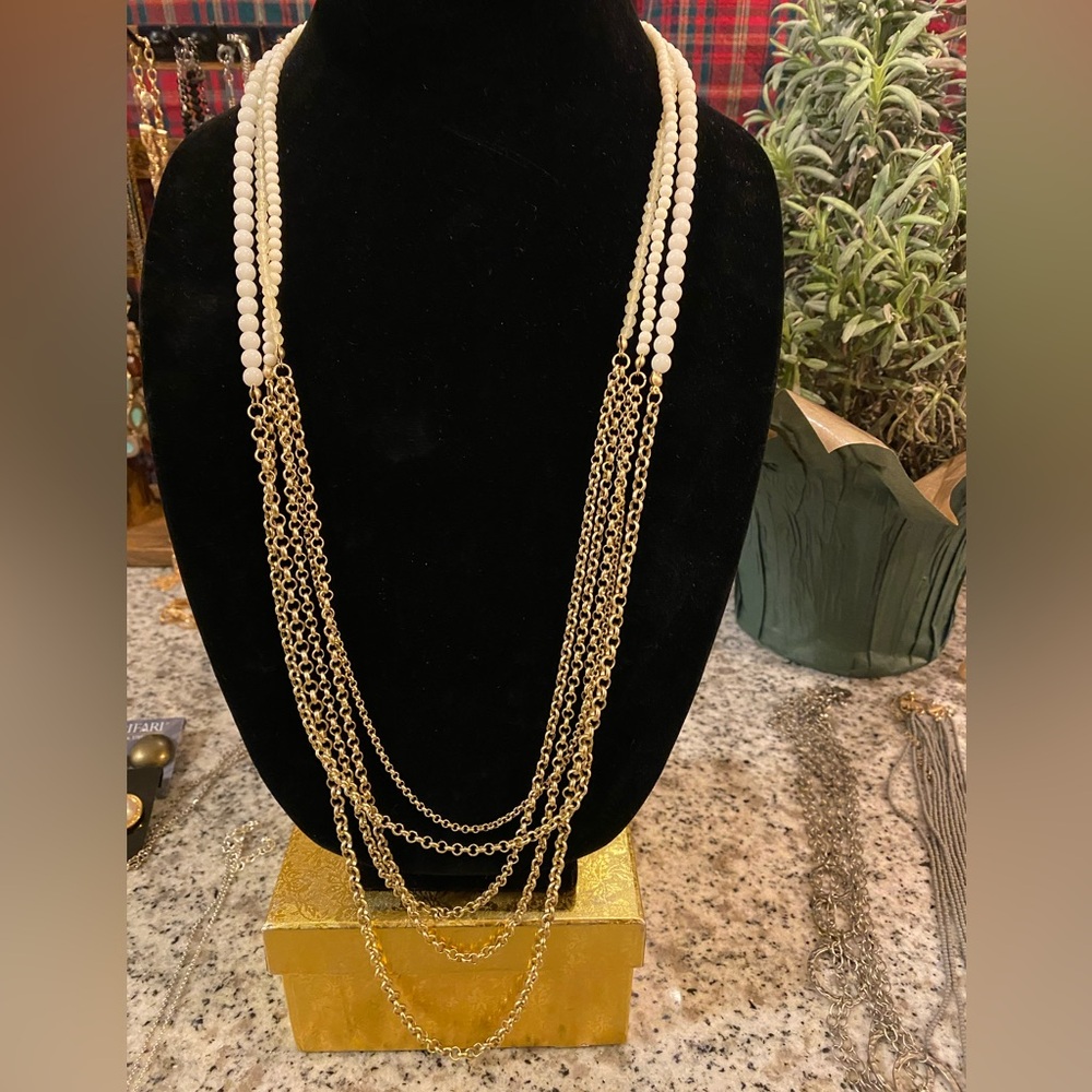 Dramatic Necklace with white/cream beaded strands with gold tone chains